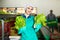 Young smiling workwoman sorting lettuce in vegetable factory