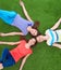 Young smilling women lying on green grass