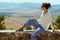 Young solo tourist woman in Pienza in Tuscany, Italy