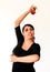 Young Spanish gipsy woman dancing flamenco with brown castanets.