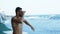 Young sport attractive man looking binoculars sea beach summer lifeguard savior naked running swim saver accident