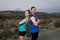 Young sport couple posing shoulder to shoulder looking cool and defiant attitude