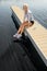 Young sport woman relax on pier water