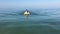 Young sporting man swims in the sea