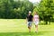 Young sportive couple playing golf on a course