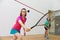 Young sportive couple practicing squash at indoor court