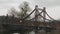 Young sportive couple running on bridge across river in park. Woman and man are jogging in the morning in recreation area. Male an