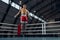 Young sportive man, boxer workout at boxing ring at sports gym. Health, motivation and exercise, boxer throwing a punch.