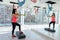 Young and sportive woman exercising in gym with dumbells