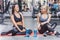 young sportive women relaxing after training at gym while sitting