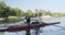 Young sports team two teenage boys with a double boat kayak on the water