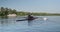 Young sports team two teenage boys with a double boat kayak on the water