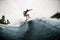 Young sports woman surfs coolly on surf board and jumps on the wave