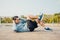 Young sportsman doing cyling crunches in park