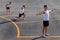 Young sportsman doing gymnastic exercises outdoors.