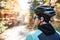 Young sportsman riding his bicycle outside in sunny autumn natur