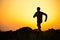 Young Sportsman Running on the Rocky Mountain Trail at Sunset. Active Lifestyle