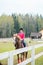 Young sportswoman riding horse in equestrian show jumps competition. Teenage girl ride a horse