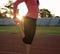 Young sportswoman stretching and preparing to run.