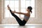 Young sporty attractive woman practicing yoga, doing Paripurna N