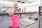 Young sporty beautiful blond woman in the gym. People beauty fitness sport healthy lifestyle concept