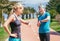 Young sporty couple starting their timer before jogging