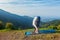 Young sporty fit woman doing yoga Sun salutation Surya Namaskar