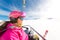 Young sporty girl skier chairlift to ski resort