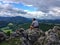 Young sporty hiker enjoys view from mountain in lower Austria. Austria. Sport and Outdoor concept.