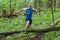 Young sporty man running trail cross in the forest