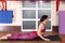 Young sporty woman doing Bhujangasana