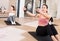 Young sporty woman exercising with pilates circle