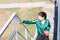 A young sporty woman with perfect body doing exercises on stairs outdoor.