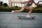 Young sporty woman riding on the longboard in the park.