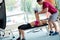 Young sporty woman with trainer exercise weights lifting