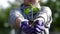 Young sprout in the hands of a young farmer. hands of a young gardener hold green seedlings in the palms. seedling close