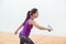 Young squash player holding the racket during game on a professional court