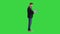 Young standing business man working on a laptop on a Green Screen, Chroma Key.