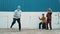 Young street dancer dancing in hip hop style with friend cheer behind. hiphop.