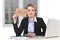 Young stressed businesswoman holding help sign overworked at office computer