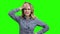 Young stressed woman on green screen.