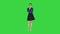 Young strict businesswoman isolated standing waiting on a Green Screen, Chroma Key.