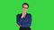 Young strict businesswoman isolated standing waiting on a Green Screen, Chroma Key.