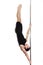 Young strong pole dancer smiling man in black clothes on pylon. White background