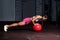 Young strong serious sweaty focused athlete fit muscular woman with big muscles holding heavy kettlebell weight barbell dumbbell