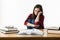 Young student with desperate expression sitting at her desk.