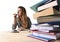 Young student girl concentrated studying for exam at college library education concept