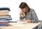 Young student girl concentrated studying for exam at college library education concept