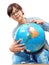 Young student girl in glasses studying geography with globe