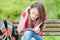 Young student girl sitting on bench